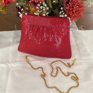 Metallic shoulder bag or satchel with detachable shoulder chain.